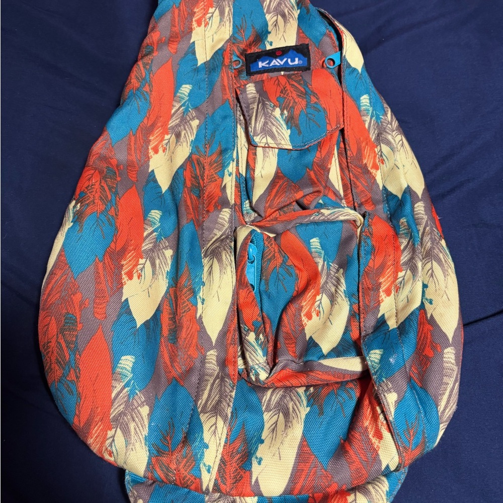 Kavu Feather Print Sling Bag in Orange, Blue, and Cream